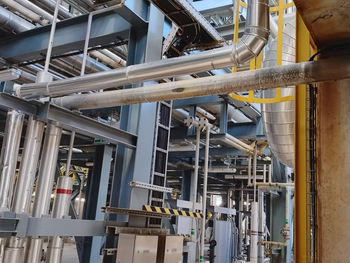 Insulated process piping at an industrial plant